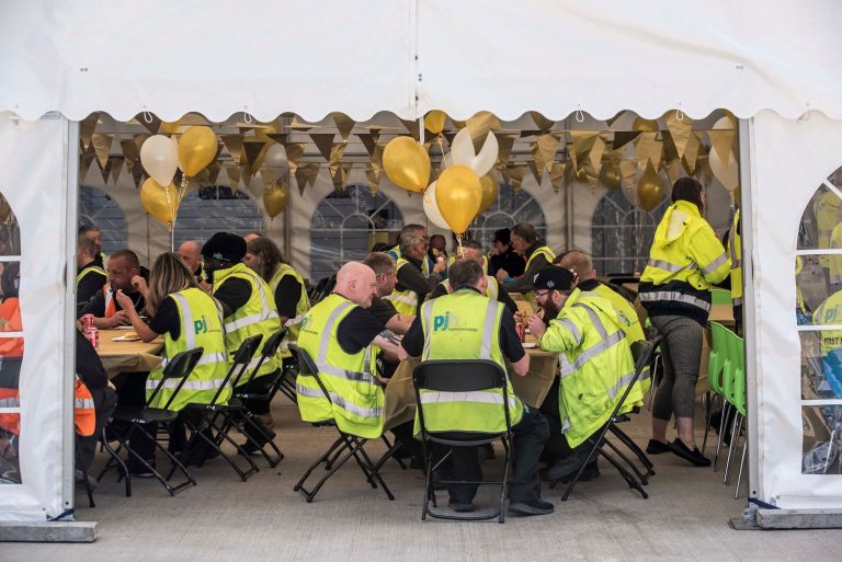 PJH raises a glass with staff to celebrate Golden 50th Anniversary PJH 50th